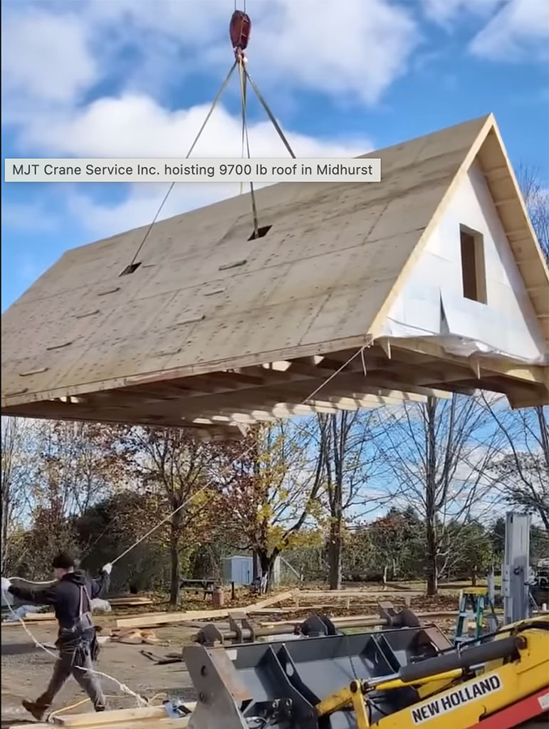 crane hoisting 9700 lb roof
